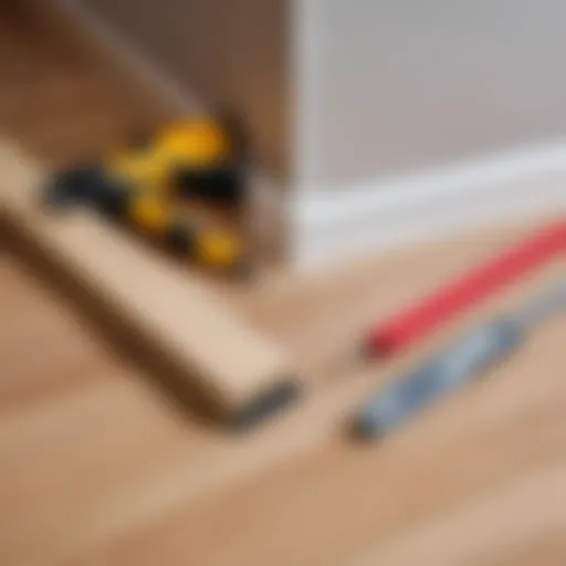 Tools and materials for installing a plastic baseboard