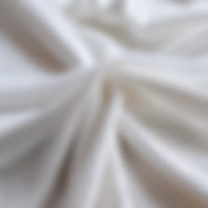 A close-up of fresh white tulle fabric with a bright sheen