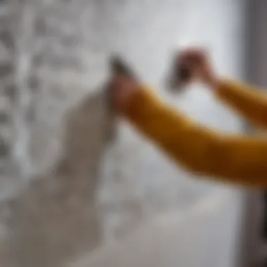 Close-up of a stencil being applied to a wall in a creative setting