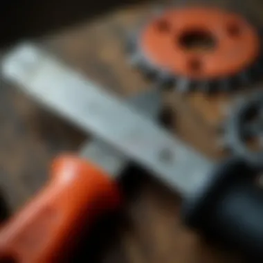 Close-up of a sharpening file against a chainsaw chain