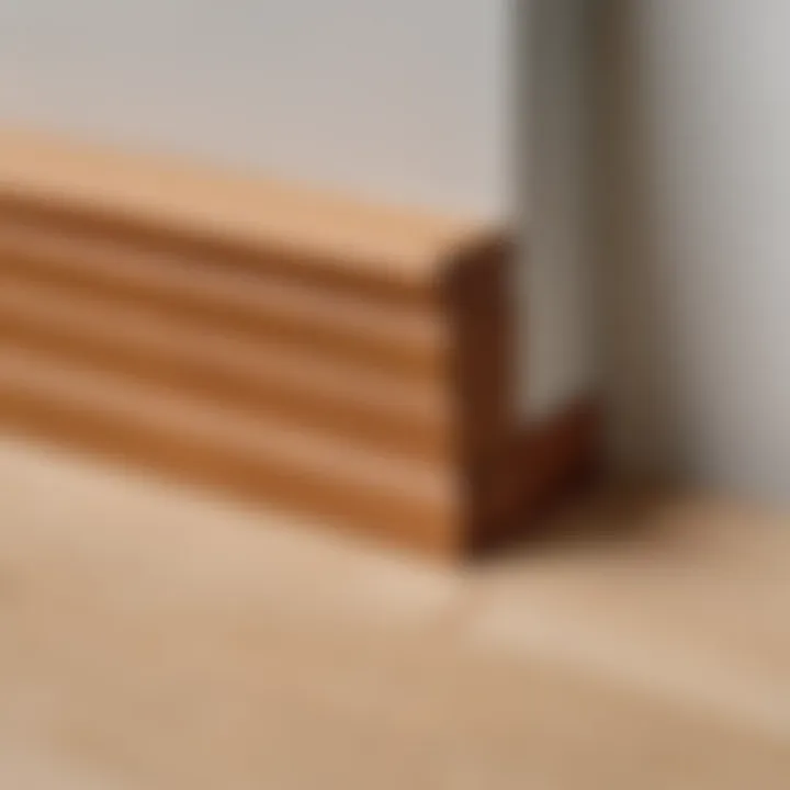 Detailed view of a completed 45-degree cut on a baseboard