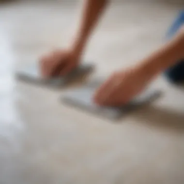 A professional installer applying adhesive to a tile surface with precision