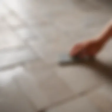 Close-up of grout being applied to tiles