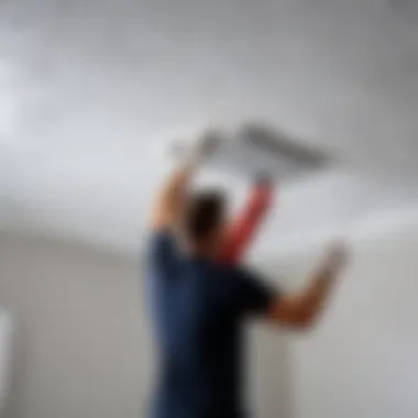 Applying adhesive to the back of a ceiling tile