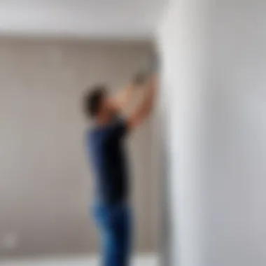 Drywall sheets being secured to a wall