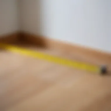 Measuring tape and marked baseboard