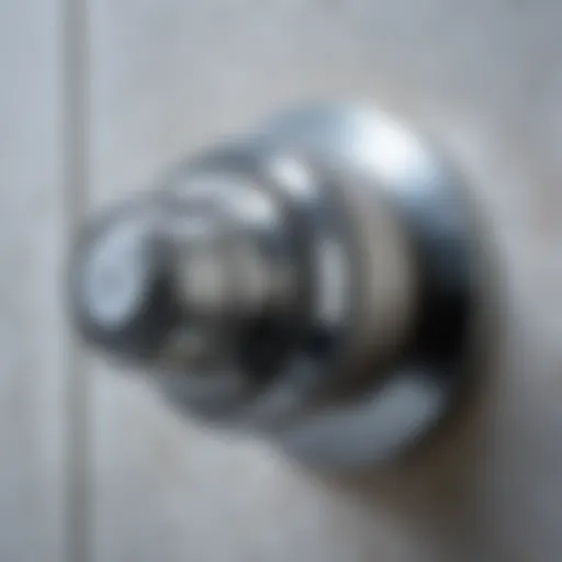 Close-up of a shower faucet showing signs of wear