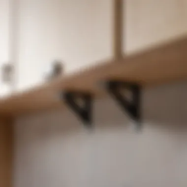 A close-up of sturdy brackets securing a kitchen cabinet to the wall