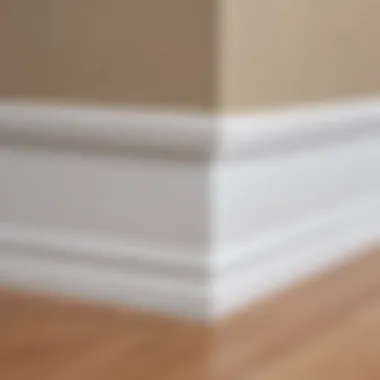 Detailed view of a completed baseboard installation with corner pieces