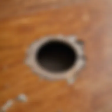 Detailed View of a Damaged Linoleum Surface Close-up of a linoleum floor with a visible hole