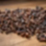 An assortment of rust-covered screws on a wooden surface