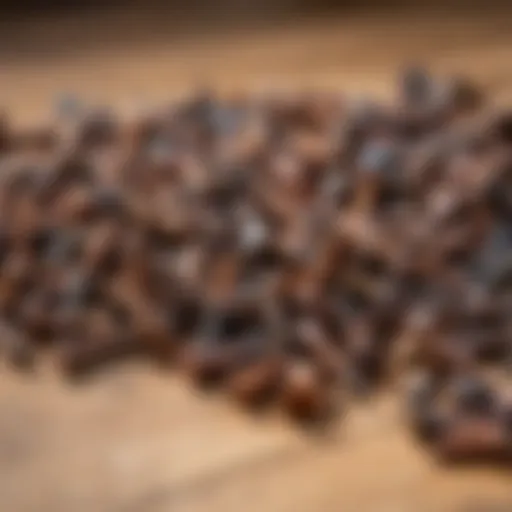 An assortment of rust-covered screws on a wooden surface