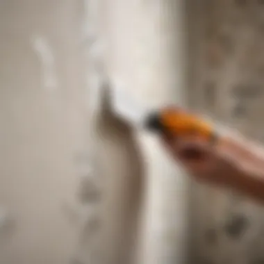 Close-up of wallpaper being peeled off the wall