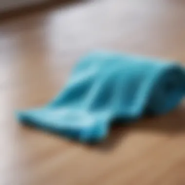 Microfiber cloth being used for cleaning a surface