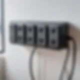 A close-up of a modern surge protector with various outlets and USB ports