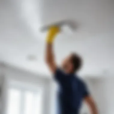 Person carefully cleaning a stretch ceiling using appropriate technique