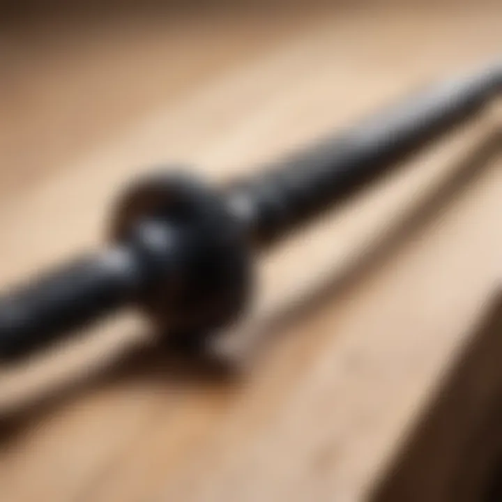 Close-up of a wood screw being driven into a wooden plank.