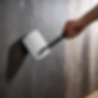 Demonstration of a spatula application on a wall surface