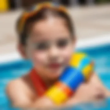 A child wearing swimming arm bands in a pool